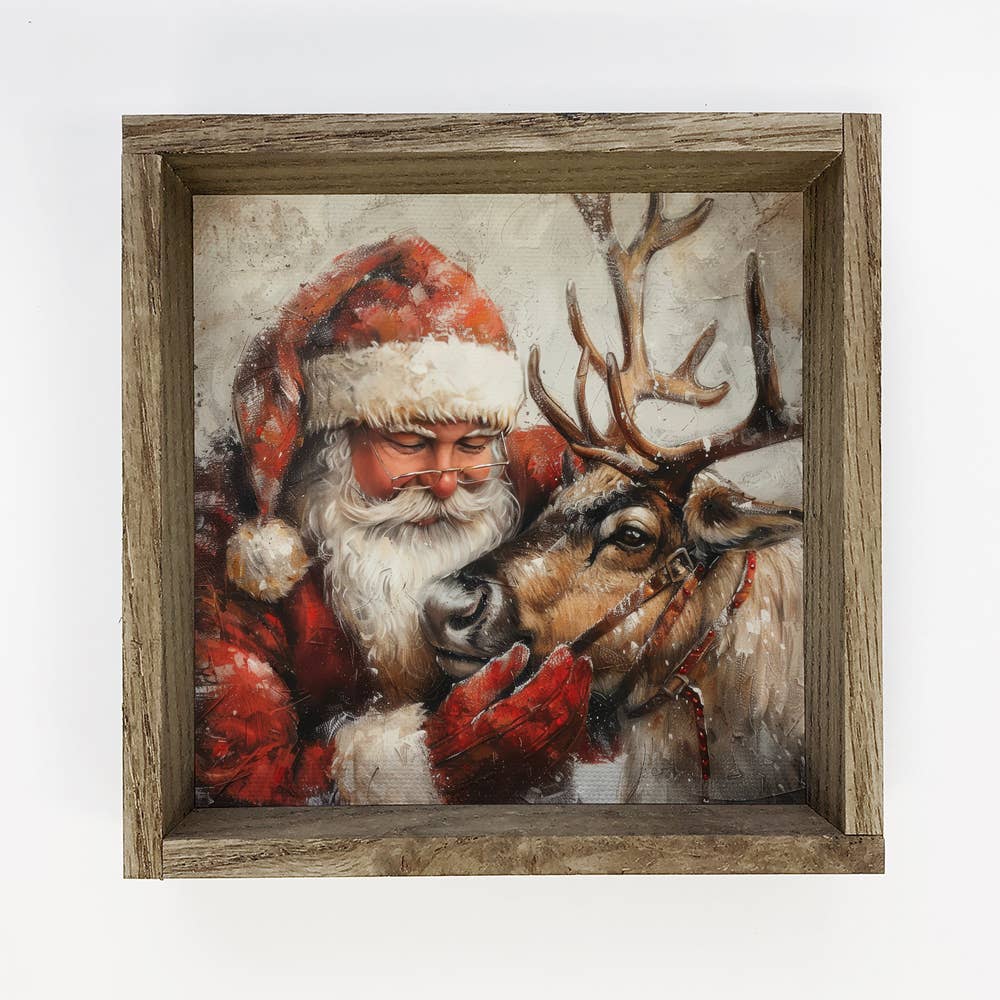 Santa Embracing Reindeer - Christmas Canvas Art - Wood Frame