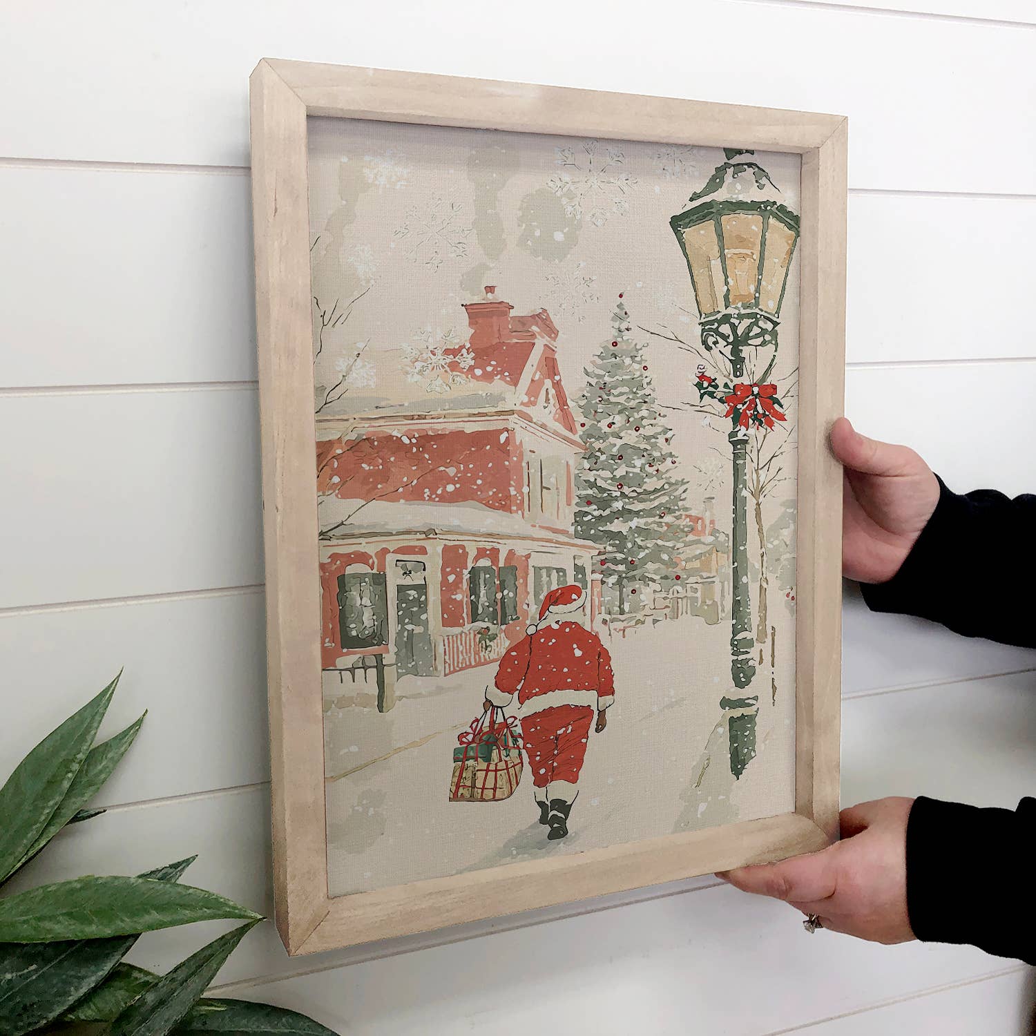 Santa Walking Through Town - Santa Canvas Art - Wood Framed