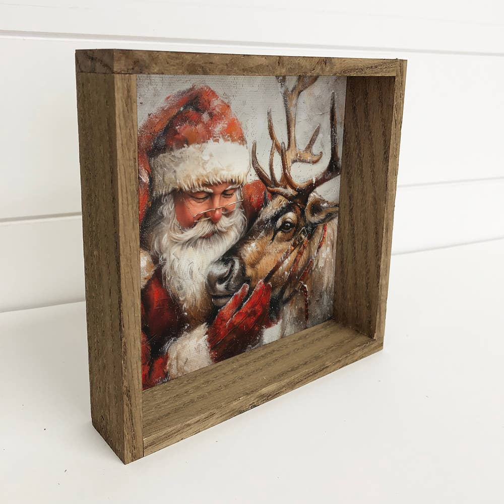 Santa Embracing Reindeer - Christmas Canvas Art - Wood Frame